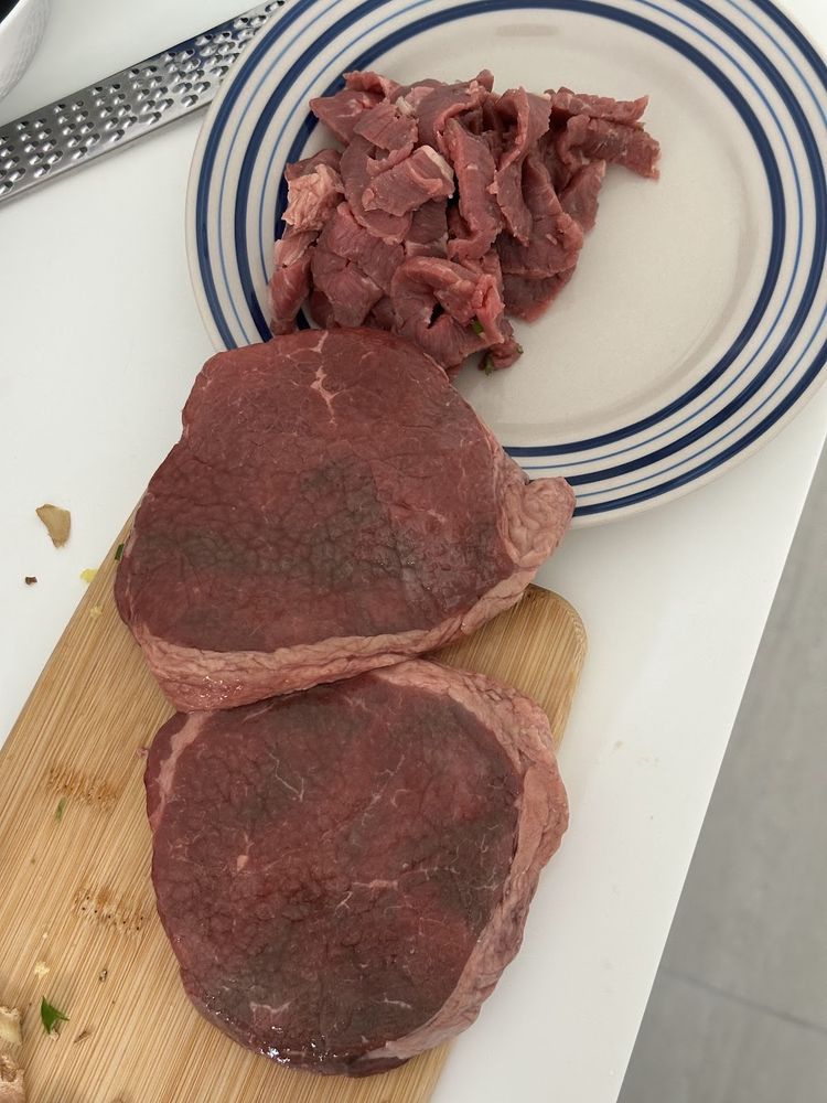 Seasoned fillet steaks tied and ready for the pan